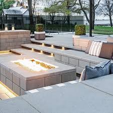 This firepit is constructed of firebrick with a concrete cap that has an old world look of weathered stone. Garden And Retaining Walls Techo Bloc