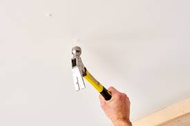 how to fix nail pops in drywall