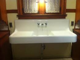 I have the holy grain list of vintage farmhouse sinks for ya'll. 1928 Vintage American Standard Single Basin Double Drainboard Porcelain Over Cast Iron Sink