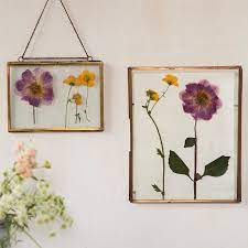 To press flowers, pick the flowers on a hot, dry day to prevent molding, and find a heavy book to press your flowers in, such as an encyclopedia, dictionary, or phone book. Pressed Flowers In Glass Diy Flix It