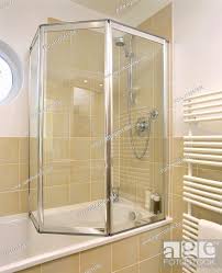 Folding Glass Shower Doors On Bath In