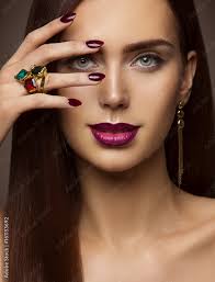 woman beauty makeup nails lips eyes