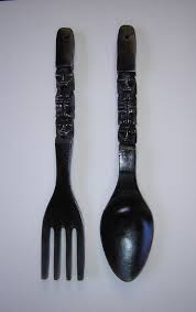 large carved wood fork and spoon wall