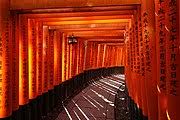 The shrine is especially known for it's thousands of red/orange torii gates lining the paths up the mountain behind the shrine. Fushimi Inari Taisha Wikipedia