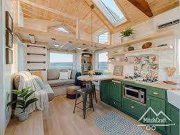 extra wide tiny house has two lofts