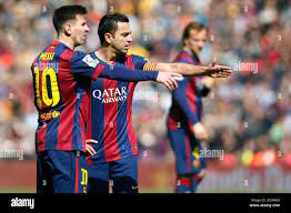 Leo Messi and Xavi Hernandez of ...