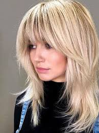 Incorporating some waves makes this one of the best hairstyles for long hair with bangs. 25 Medium Blonde Hairstyles To Show Your Stylist Pronto Southern Living