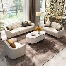 beige leather sofa and loveseat