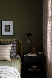 Rattan Bed On Olive Green Wall