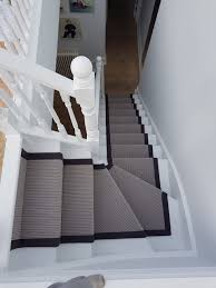 grey carpet runner to stairs in