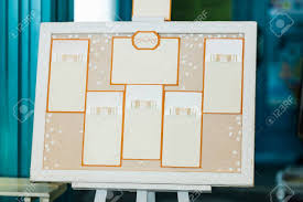 Wedding Seating Chart On The Easel In The Park Indoors