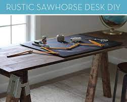 I've had this desk for a few years now and i'm just not getting tired of it. How To Build A Rustic Sawhorse Desk Without Picking Up A Hammer Sawhorse Desk Diy Craft Room Table Diy Desk