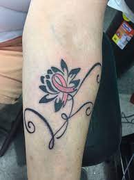 Personalize yours for unique items. This Tattoo Honors My Sister In Law A Lotus Flower And A Pink Ribbon Pink Ribbon Tattoos Cancer Tattoos Cancer Ribbon Tattoos