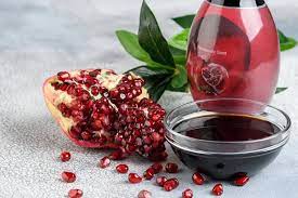Narsharab Saucer Of Pomegranate Sour Sauce With Fresh Ripe Pomegranate  gambar png