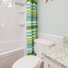 coastal bathroom with green countertops