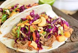 pulled pork tacos with tropical slaw