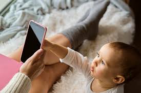 cute baby touching smart phone