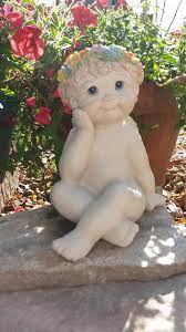 small cherub garden statue