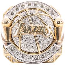 The los angeles lakers' championship ring has 804 stones, 17 purple amethysts and hidden features honoring lakers legend. History Lakers Championship Rings Lakers Championship Rings Nba Championship Rings Championship Rings