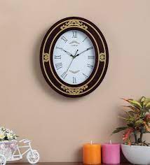 brown wooden oval shape clock with