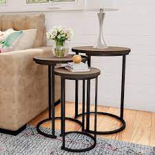 black wooden round nesting side tables