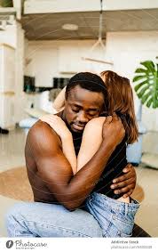 loving multiethnic couple hugging at
