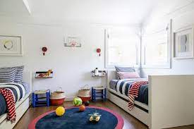 Red And Navy Bedding On White Twin Beds