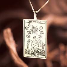 Maybe you would like to learn more about one of these? Tarot Star Card Pendant Gold