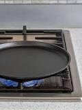 How do you use a cast iron griddle on a stove top?