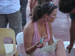 Candid nipple slip from a lady in a pink dress - Voyeur Hub