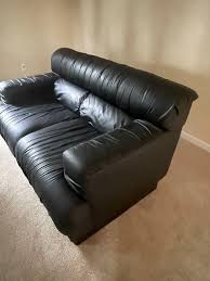 black leather couch in