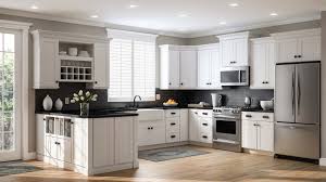 Clean white kitchen cabinets with black hardware in a minimalist kitchen. How To Style Your White Shaker Cabinets Debbie Davis Design