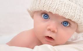 baby s white knit hat child blue eyes