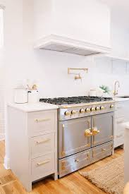 gray kitchen cabinets with la cornue