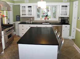 Next, you can build up a modern look by combining antique white kitchen cabinets with black appliances. Dark Granite Countertops Hgtv