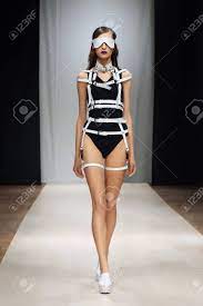 Fashion Model In Leather Bondage On Runway Stock Photo, Picture And Royalty  Free Image. Image 115607555.
