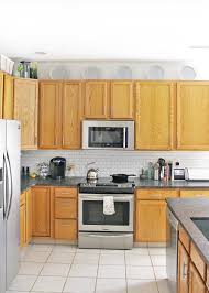 ways to decorate above kitchen cabinets