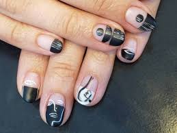 nails with abstract faces on them