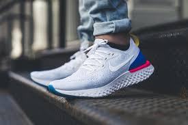 This nike epic react sports a teal and pink knitted detail throughout its black flyknit upper with a bootie shape ankle collar for easy entry. Nike Epic React Flyknit Performance Op Ed Hypebeast