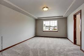 Empty Basement Room With White Walls