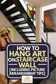 Many of these frames had the double hook in the when people think about hanging pictures, your first thought is two hangers are better than one because it won't shift or move on you. How To Hang Art On Staircase Wall Inc Picture Arrangement Tips Home Decor Bliss