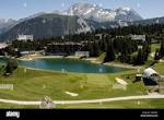 Golf course with hotel and lake in the French alps above ...