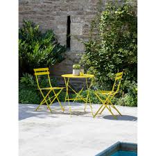 Reading a book and drinking tea while sitting on an make sure to leave enough space around your furniture so that you can walk comfortably. Garden Trading Rive Droite Bistro Set Small Yellow Black By Design