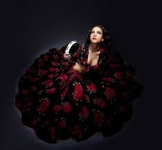 young woman posing in flamenco costume