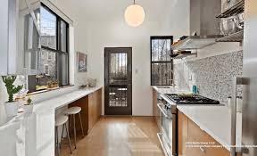My kitchen cabinets are all a natural wood finish inside except for the few that have glass doors and the open shelves which were ordered to be finished to match the exterior. For 800k A Renovated Four Story Historic Townhouse In Mott Haven Where There S Still Some Upside 6sqft