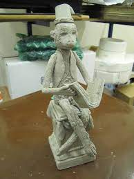 I can't be certain of its survival, so here's my SCP-050 statuette before  it goes into the kiln. : r/SCP
