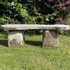 A Garden Bench With An Oak Seat And