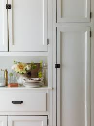 The yellow oven and colorful appliances are a great way to personalize a cooking space. Black Hardware Kitchen Cabinet Ideas The Inspired Room