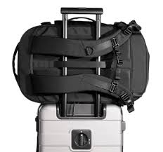 attach a backpack to rolling suitcase