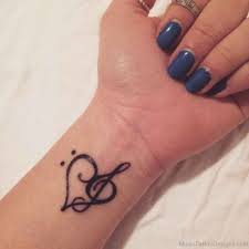 This is a great way to express your love for music and make it everlasting. Black Outlined Music Note Heart Tattoo On Inner Wrist For Women